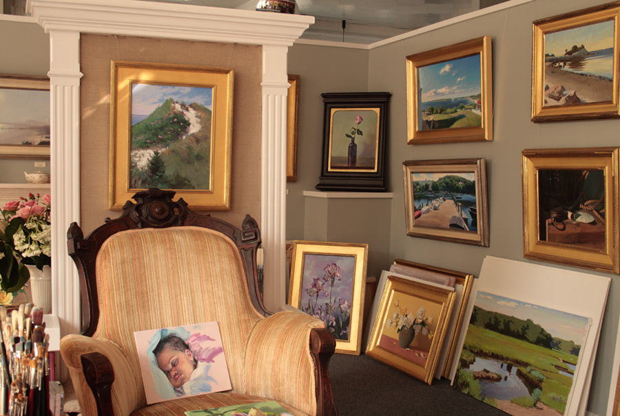 Variety of oil paintings in the gallery.